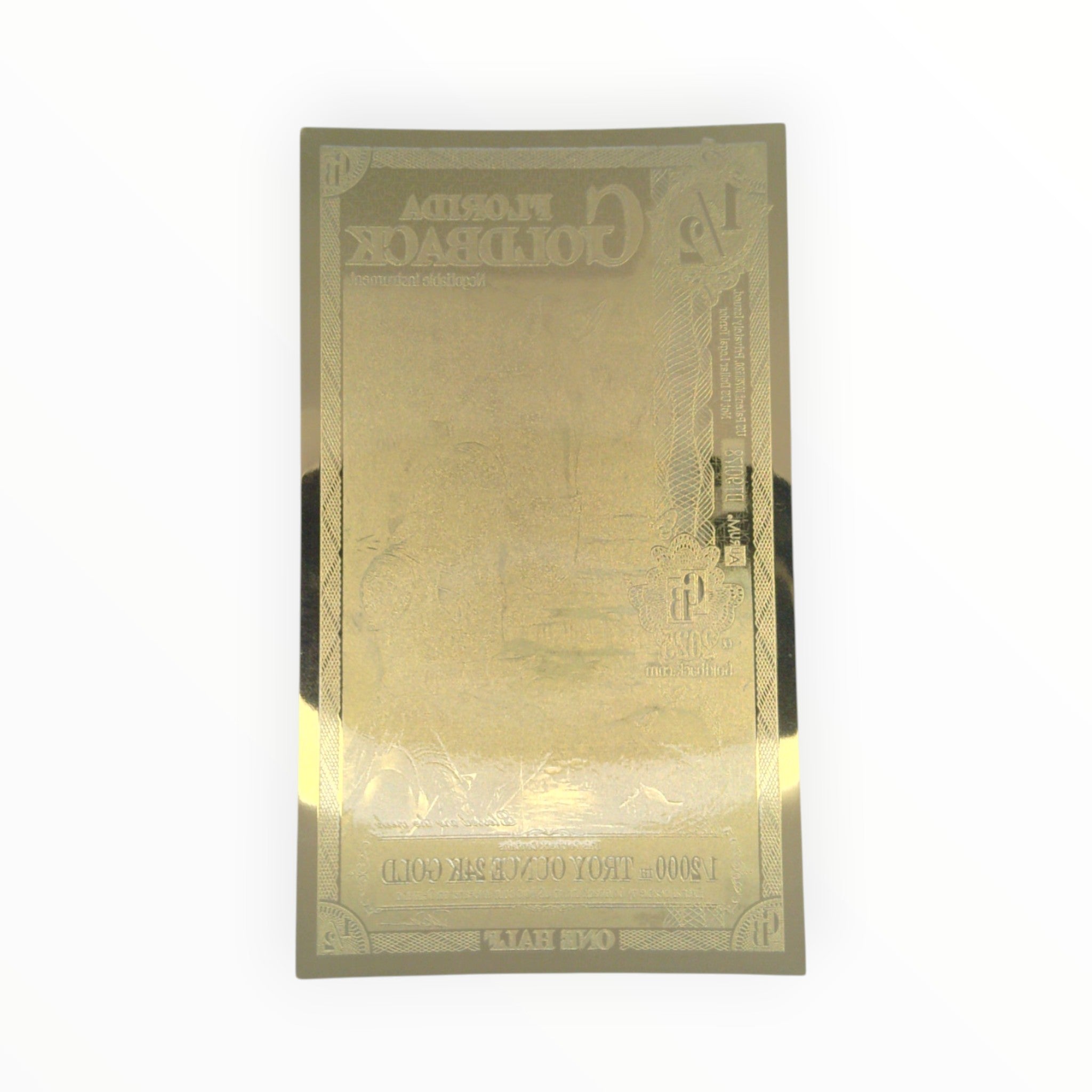 Back of a circulated ½ Alpha Florida Goldback Gold Note showing the official reverse design and security features.
