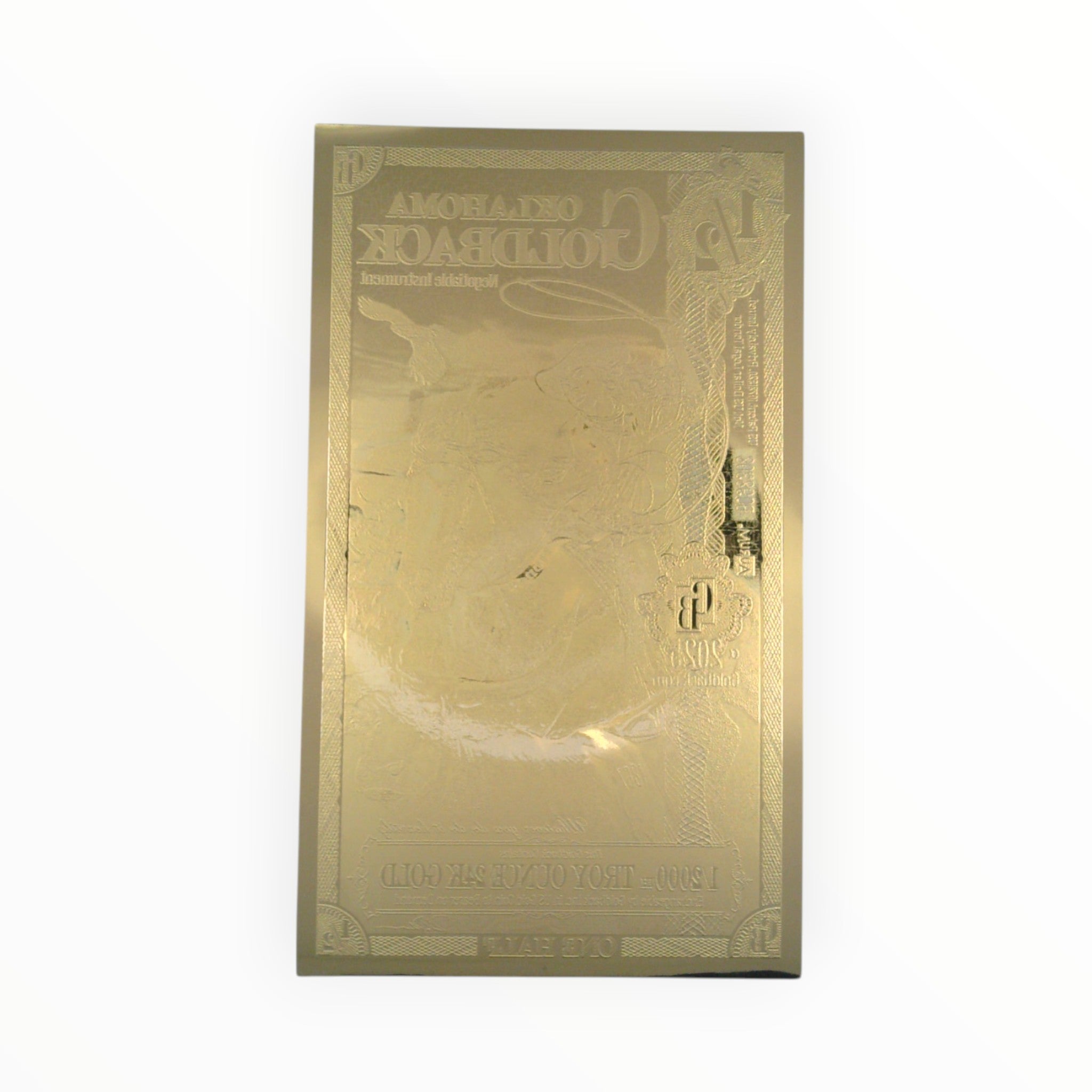 Back of a circulated 1/2 Alpha Oklahoma Goldback Note showing the official reverse design.