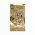 Front of a 1 New Hampshire Goldback containing 1/1000 troy ounce of .999 fine gold with New Hampshire-themed artwork.
