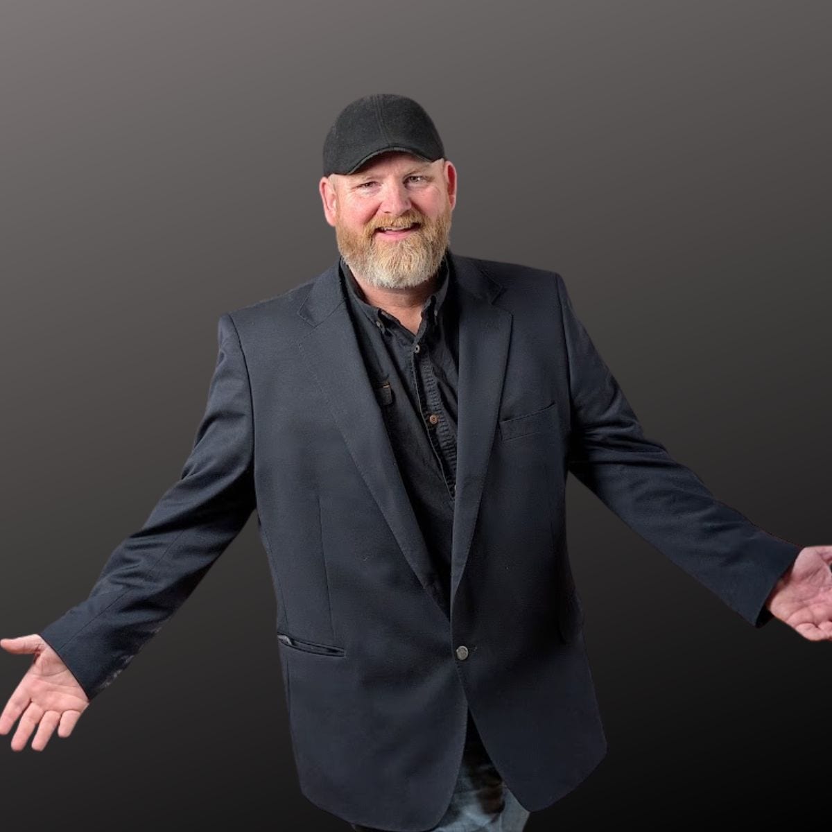 Mr. Vann wearing a boston scally cap with a grey background