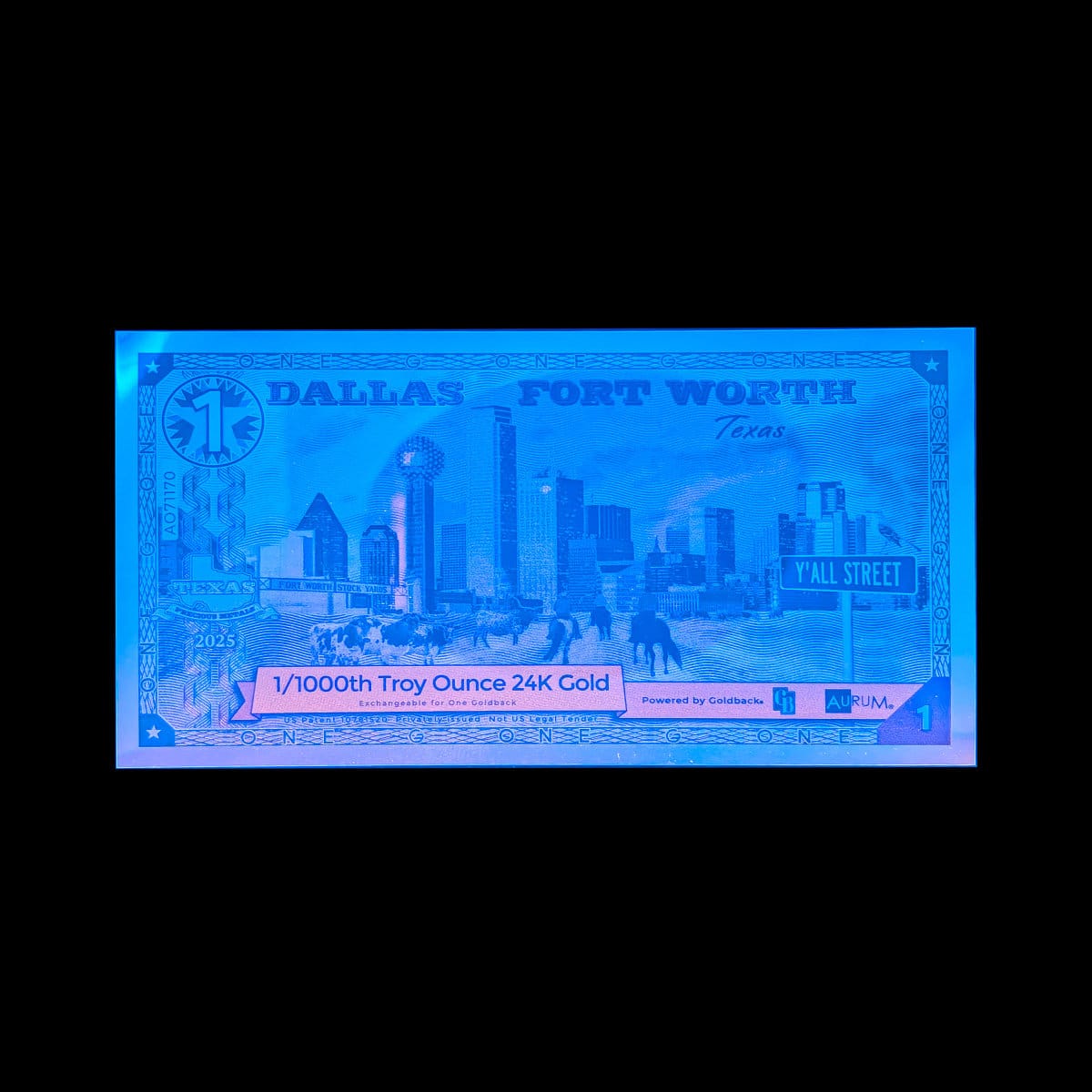Blacklight on a Dallas Fort Worth 1 Goldback on a black cloth
