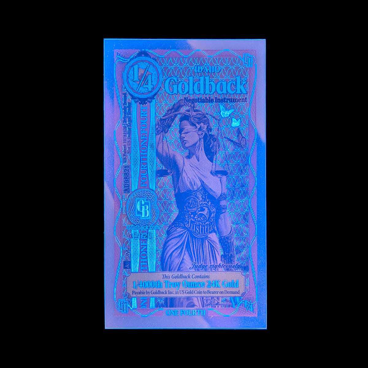 Blacklight 'Goldback' negotiable instrument with a stylized figure on a black background