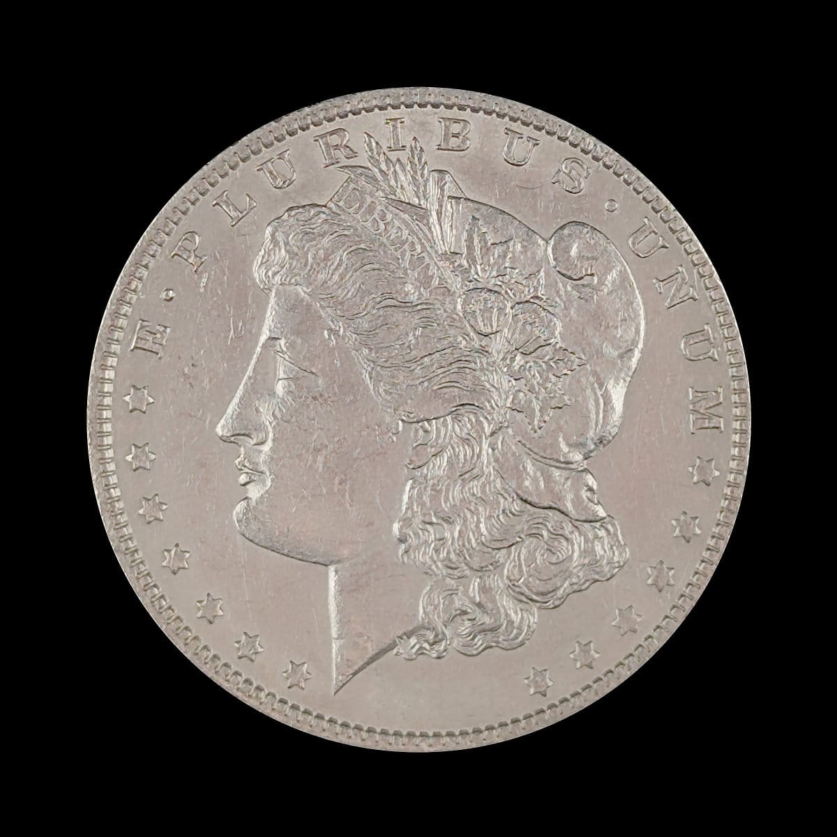 Silver coin with a profile of a person and star design on a black background