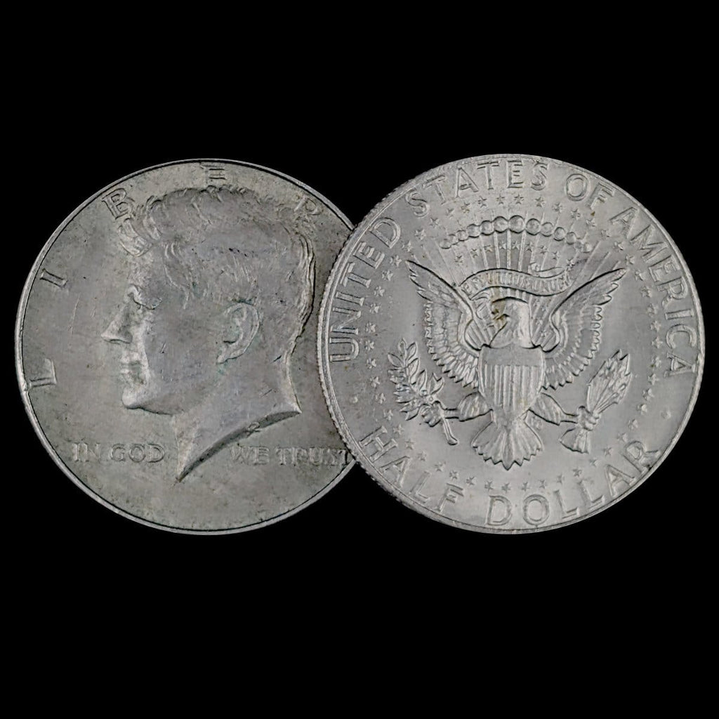 Two sides of a Kennedy Half Dollar coin on a black background