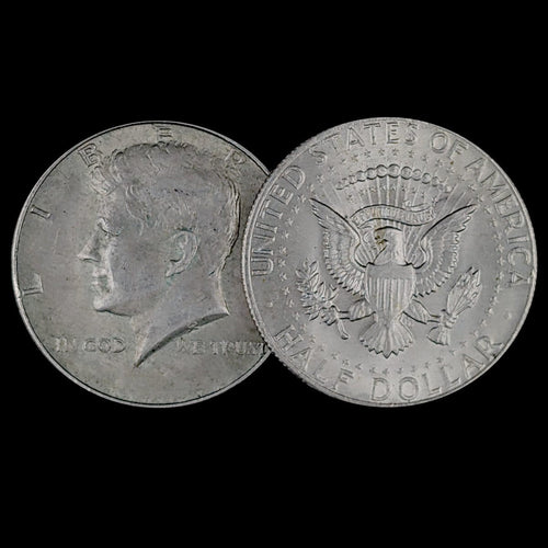 Two sides of a Kennedy Half Dollar coin on a black background