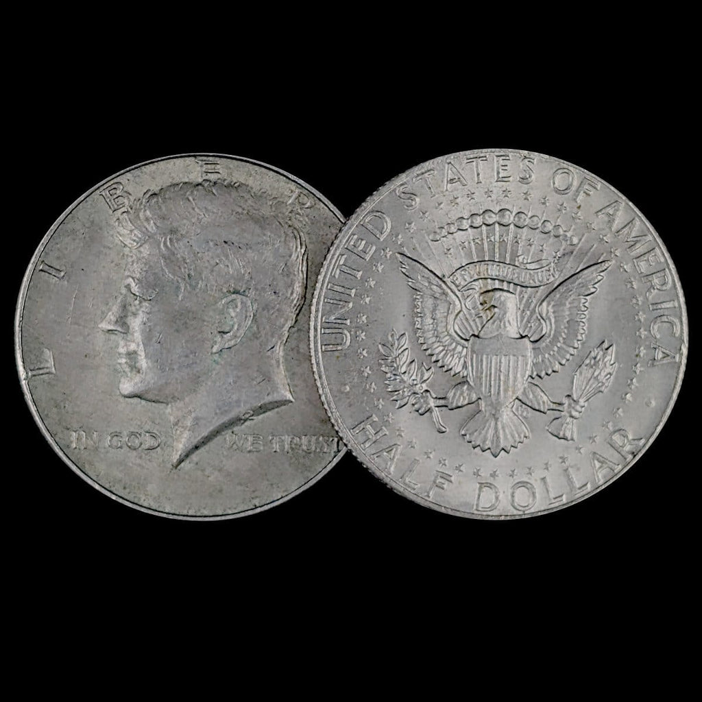 Two sides of a Kennedy Half Dollar coin on a black background