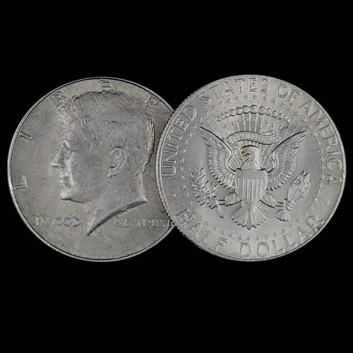 Two sides of a Kennedy Half Dollar coin on a black background