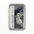 A silver bar in a clear plastic protective capsule, featuring the Scottsdale Mint logo and a crowned lion design on a white and dark background.