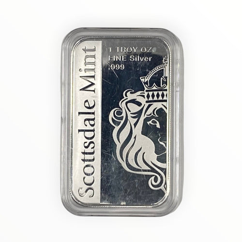 A silver bar in a clear plastic protective capsule, featuring the Scottsdale Mint logo and a crowned lion design on a white and dark background.