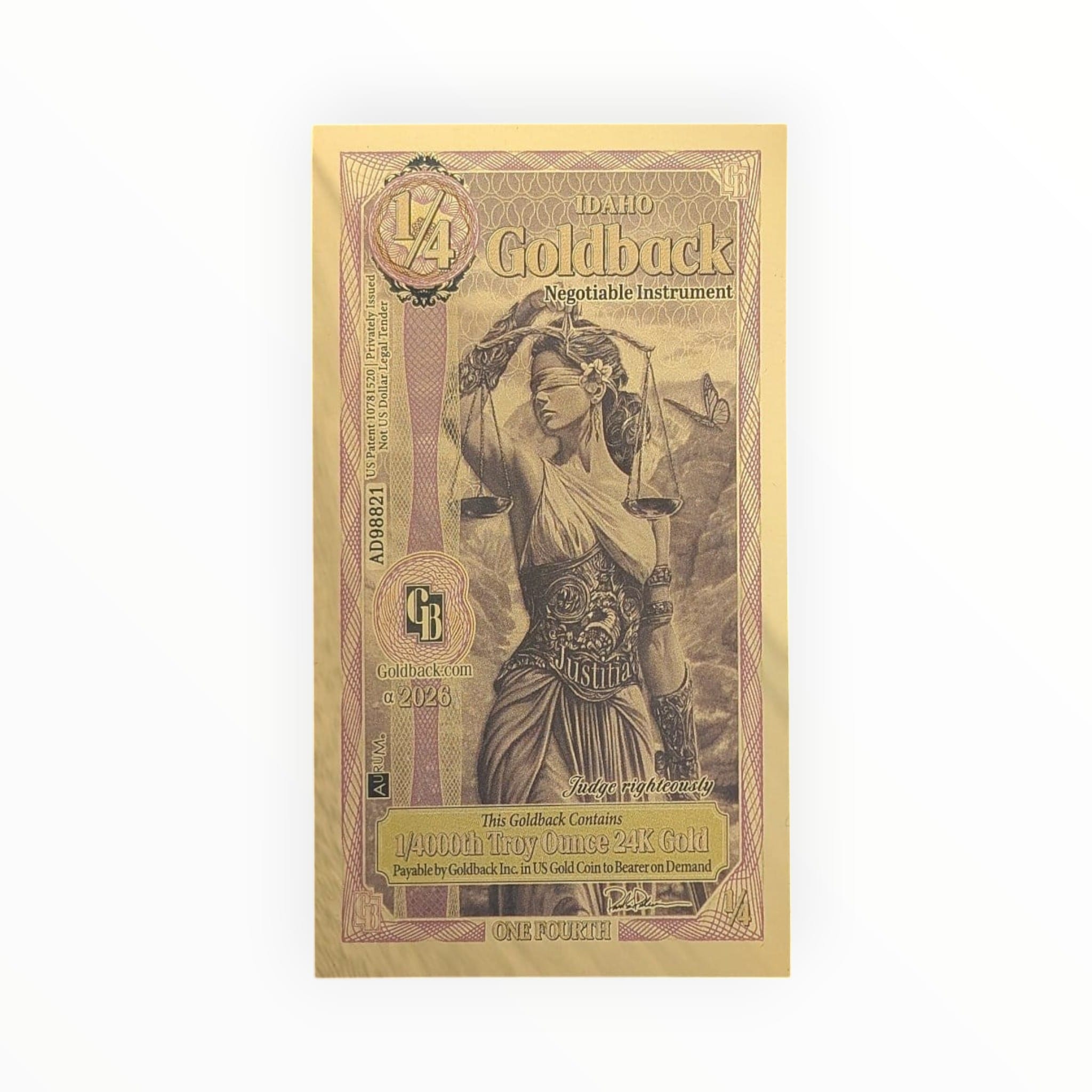 Goldback Idaho negotiable instrument with a woman holding scales on a black background